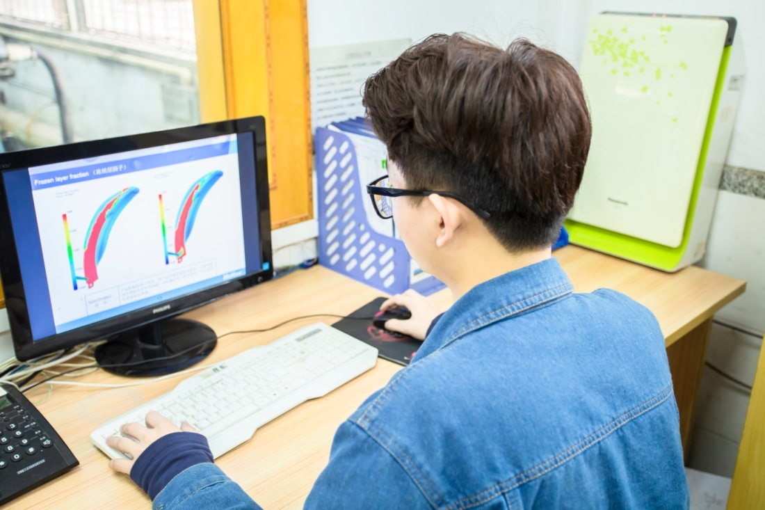 Engineering team reviewing CAD design